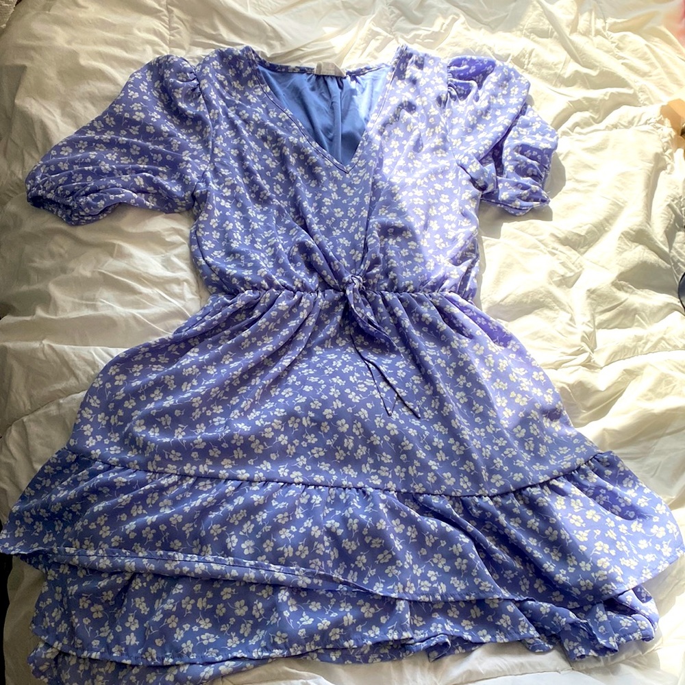 Purple dress with white flowers size medium never worn before.